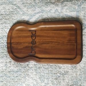 Wooden bread board made in Taiwan with minor wear.